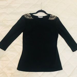 Embellished structured blouse.